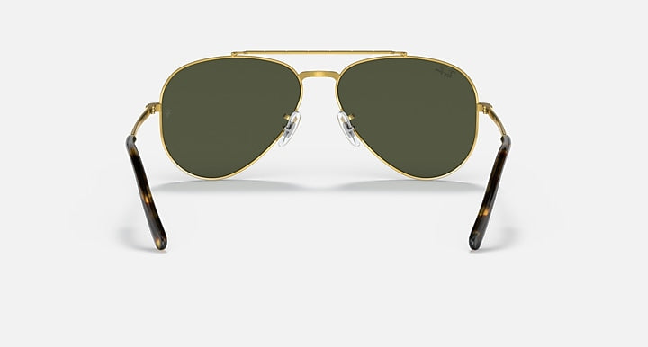 Gold-tone aviator sunglasses with dark green lenses and rounded aviator shape
