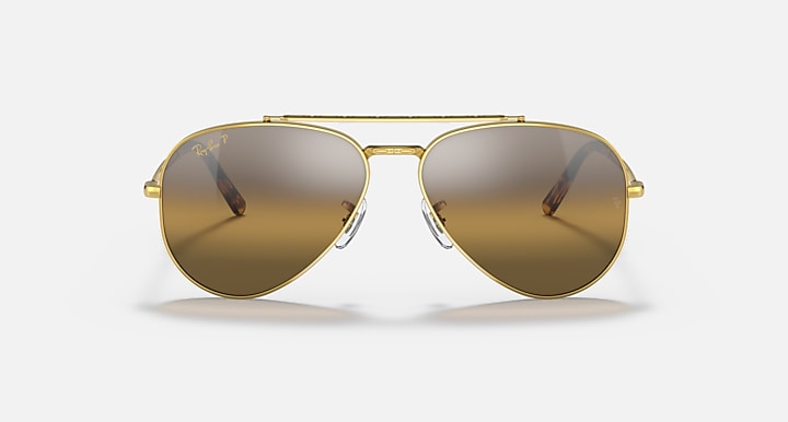 Aviator sunglasses with gold frame and brown mirrored gradient lenses; full front view