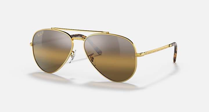 Aviator sunglasses with gold frame and brown gradient lenses; metal nose bridge and temples