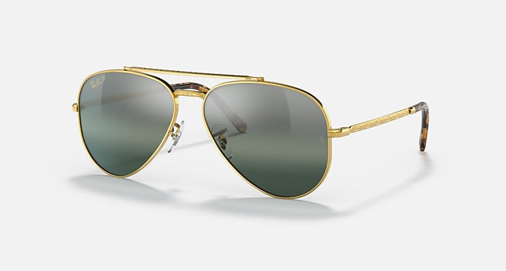 Aviator sunglasses with gold frame and green gradient lenses; side profile