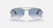 Rose gold aviator sunglasses with clear-to-blue gradient lenses and nose bridge
