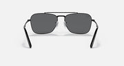 Black rectangular sunglasses with dark grey lenses and metal bridge detailing