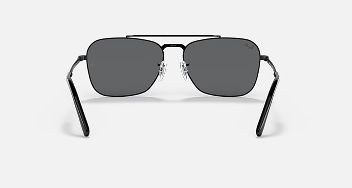 Black rectangular sunglasses with dark grey lenses and metal bridge detailing