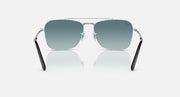 Ray-Ban Caravan sunglasses with silver frame, dark teal lenses, and black temple tips