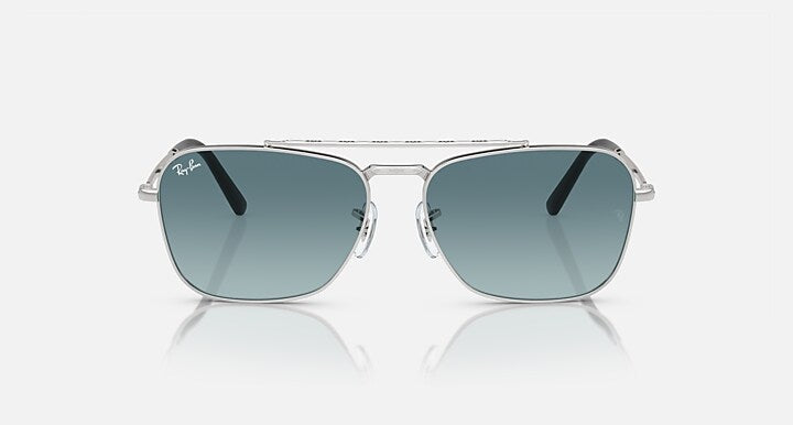 Ray-Ban Caravan sunglasses, silver metal frame with dark teal lenses and bridge detail