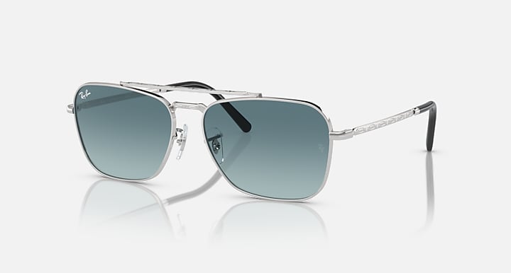 Ray-Ban Caravan sunglasses with silver metal frame and dark teal mirrored lenses