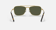 Gold rectangular sunglasses with dark green lenses and curved black-tipped temples