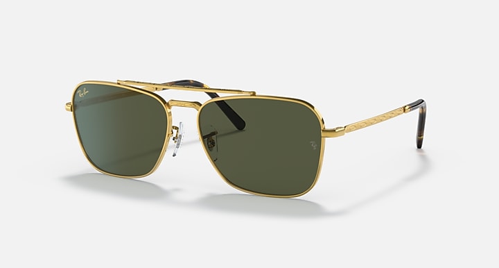 Gold rectangular sunglasses with dark green lenses and thin metal arms