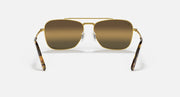 Caravan-style sunglasses with gold frame and dark brown lenses, front view