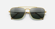 Caravan-style sunglasses with gold frame and black gradient lenses, centered front view