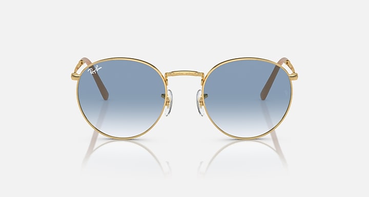 Gold-tone round sunglasses with blue gradient lenses, featuring small top hinge details