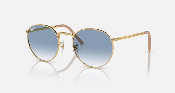 Gold-tone round sunglasses with blue-to-gray gradient lenses and slim metal temples