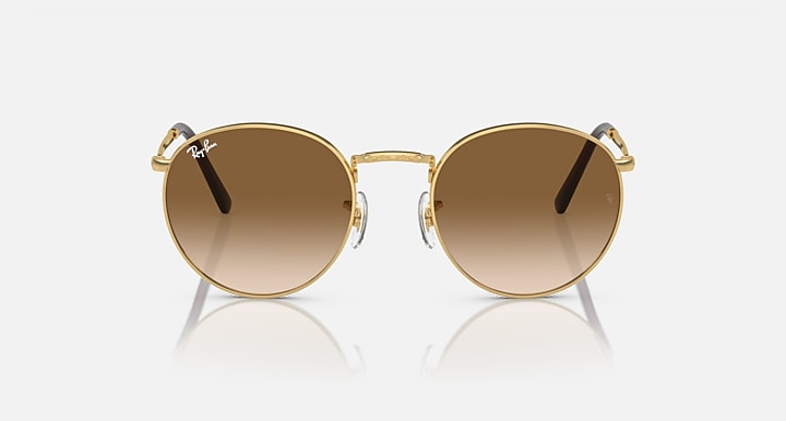 Gold-tone round sunglasses with brown gradient lenses, front view with visible bridge