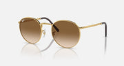 Gold-tone round sunglasses with brown gradient lenses and dark temple accents