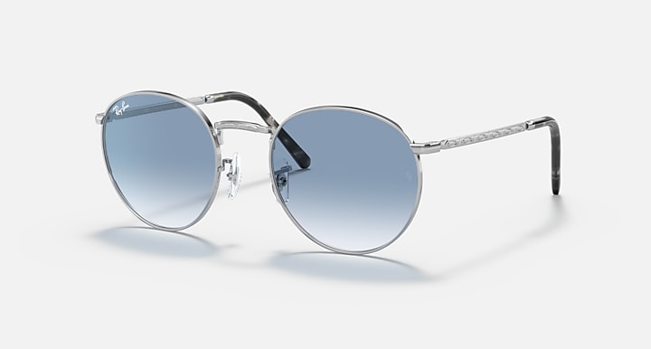 Ray-Ban round sunglasses with silver frame and blue gradient lenses, black temple tips