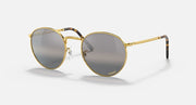 Round gold metal sunglasses with dark gray gradient lenses and slim nose bridge