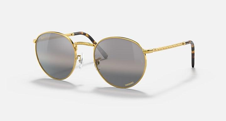 Round gold metal sunglasses with dark gray gradient lenses and slim nose bridge