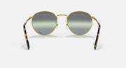 Round gold metal sunglasses front view with dark gray lenses and patterned side arms