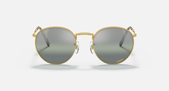 Round gold metal sunglasses front view with dark gray gradient lenses and visible hinges