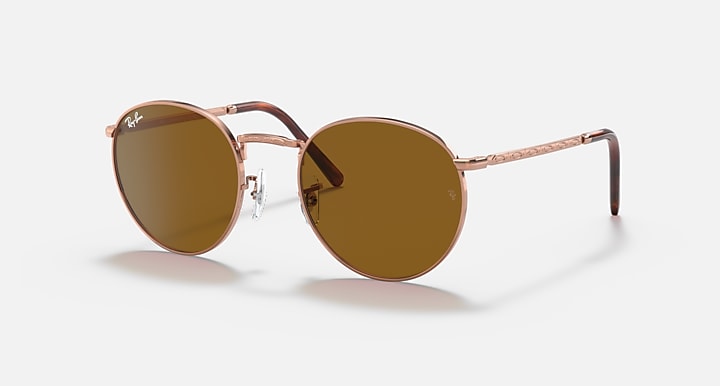 Ray-Ban round sunglasses with rose-gold frame and brown gradient lenses, slim dark temples