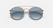 Round metal sunglasses with rose-gold frame and dark blue lenses, double-bridge front