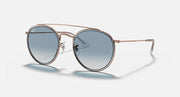 Round metal sunglasses with rose-gold frame and blue mirrored lenses, double-bridge detail