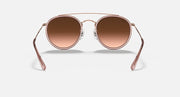 Rose-gold round sunglasses with brown mirrored lenses, front view with double bridge