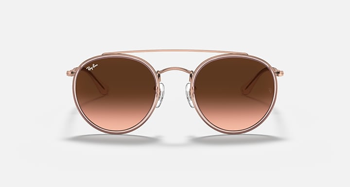 Rose-gold round sunglasses with brown mirrored lenses, front view