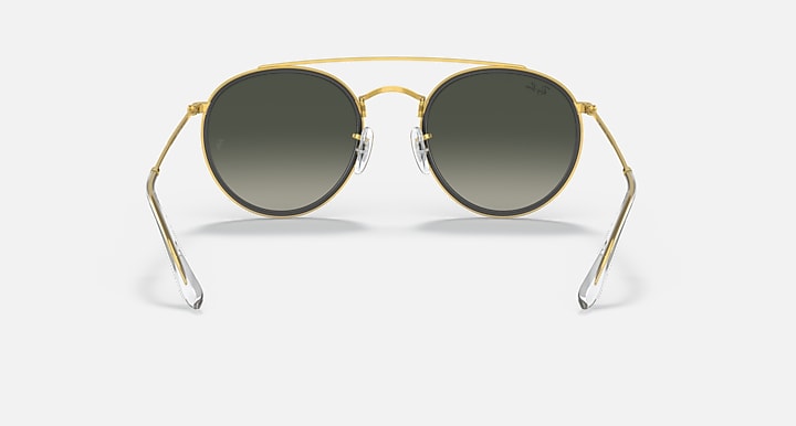Ray-Ban round sunglasses with gold frame and dark gradient lenses, straight-on front view