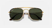 Gold hexagonal sunglasses with dark green lenses, front view with hinge hardware