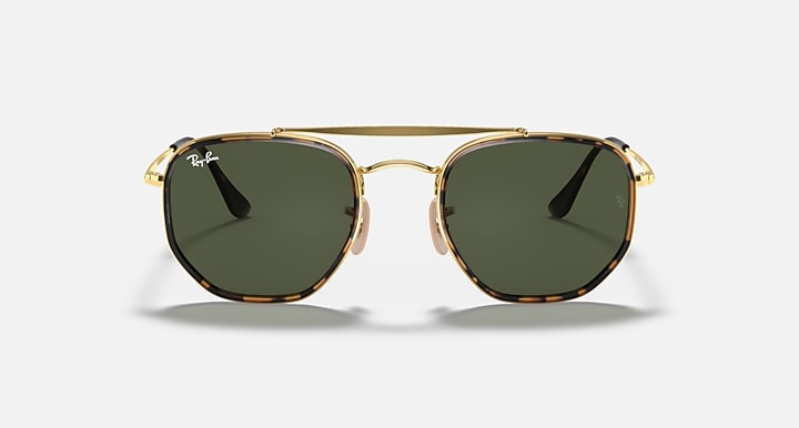 Gold hexagonal sunglasses with dark green lenses, front view with bridge detail