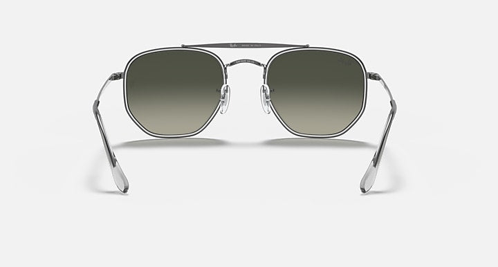 Gunmetal hexagonal sunglasses with dark green lenses, front view with full metal frame