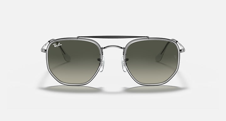 Gunmetal hexagonal sunglasses with dark green lenses, front view with rounded bridge