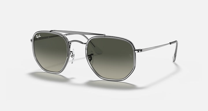 Gunmetal hexagonal sunglasses with dark gray-green lenses and thin metal temples, full rim