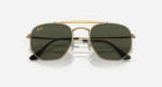 Hexagonal sunglasses front view with gold frame and dark green mirrored lenses