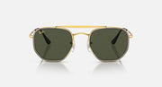 Hexagonal sunglasses with gold frame and dark green lenses