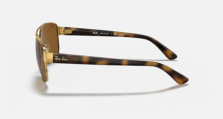 Ray-Ban RB3663 sunglasses with gold frame and brown lenses, side profile