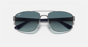 Sunglasses with dark gradient lenses and gunmetal frame, rounded rectangular shape