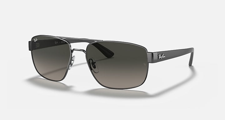 Angled sunglasses with gunmetal frame and blue-gradient lenses, metal nose bridge