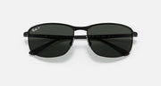 Polarized sunglasses with dark tinted lenses and black frame, straight on.