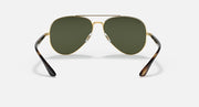 Ray-Ban aviator sunglasses with gold frame, green lenses, and tortoise temples