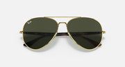 Ray-Ban aviator sunglasses with gold frame and dark green lenses, front view