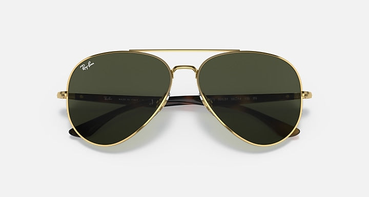 Ray-Ban aviator sunglasses with gold frame and dark green lenses, front view