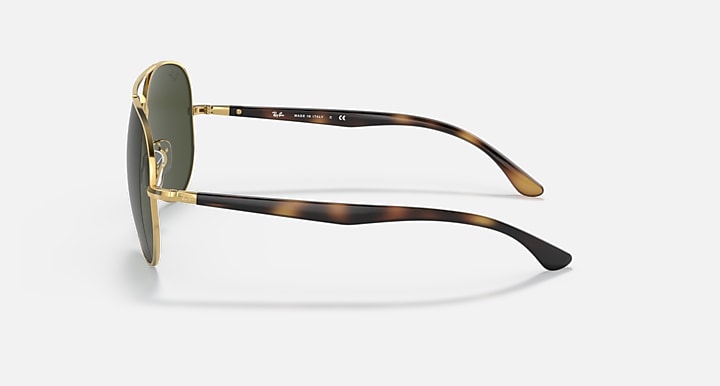 Ray-Ban aviator sunglasses with gold frame, green lenses, and dark tortoise arms