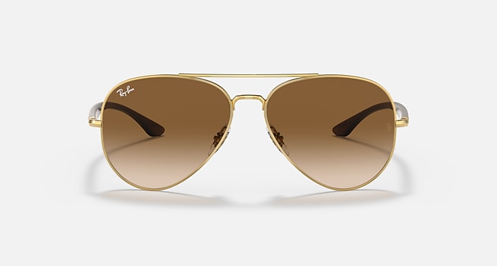 Ray-Ban aviator sunglasses with gold frame and warm brown gradient lenses