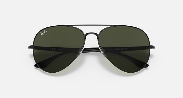 Ray-Ban aviator sunglasses with dark green lenses and dark metal frame, straight on view.