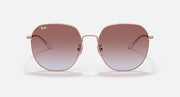 Rose gold round sunglasses with brown gradient lenses and curved metal temple tips