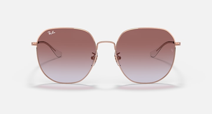 Rose gold round sunglasses with brown gradient lenses and curved metal temple tips