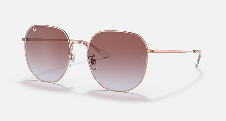 Rose gold round sunglasses with brown gradient lenses and thin metal frame