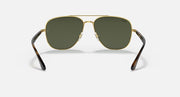 Ray-Ban aviator sunglasses front view, gold frame with dark green lenses and dark arms